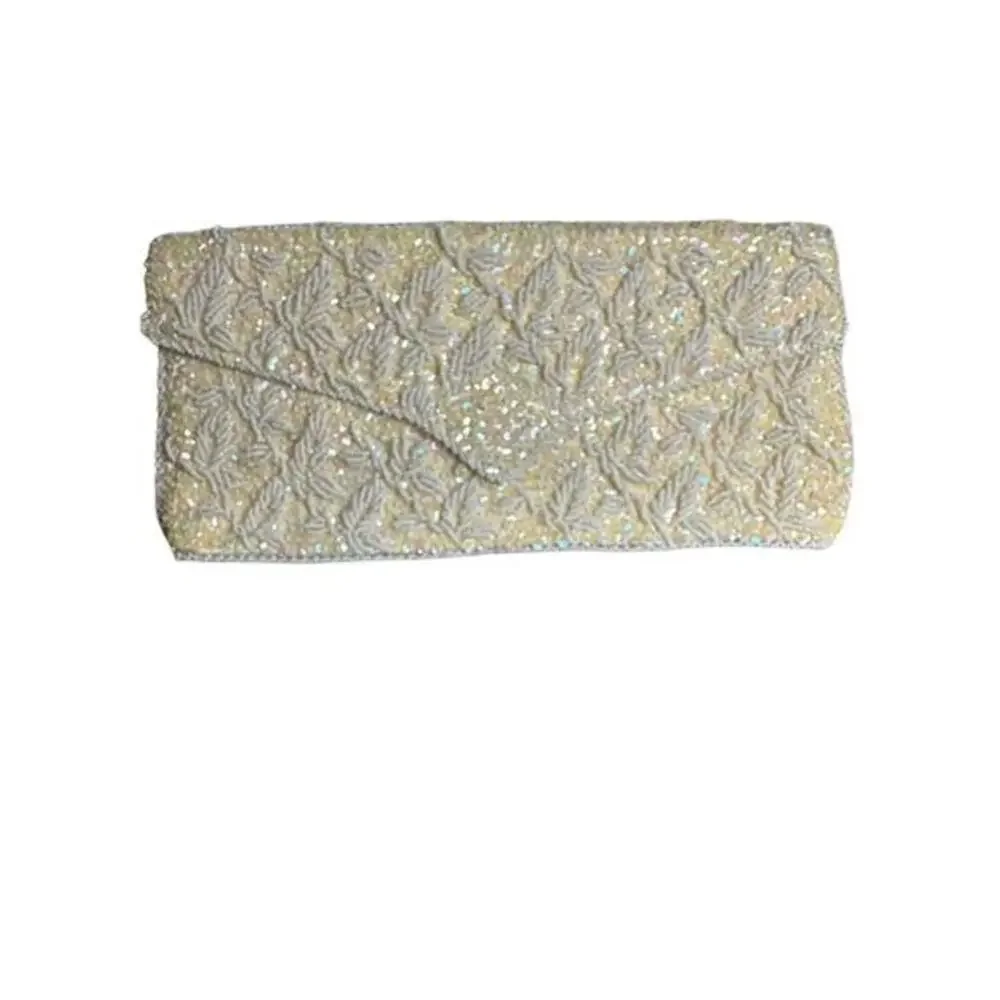Clutch white size 9”x4” has some stains